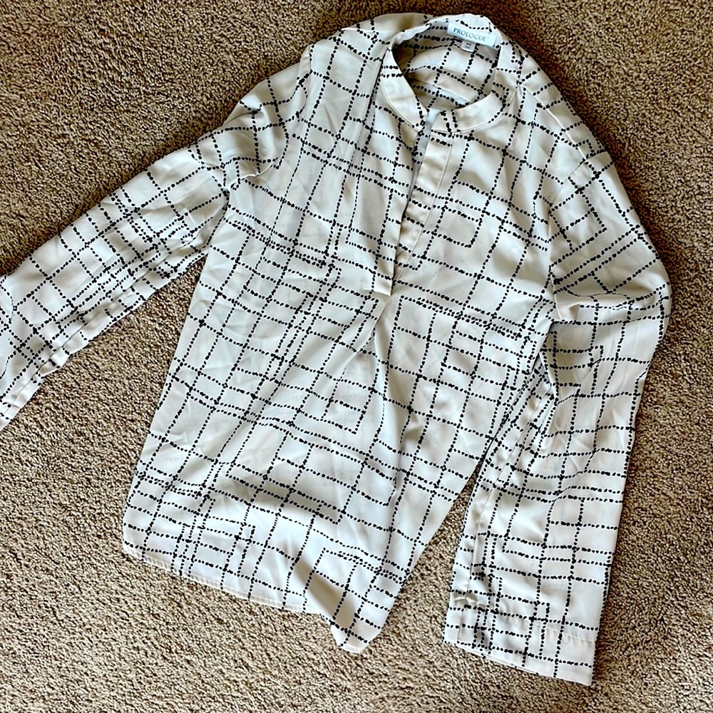 Like new cream and black shirt.